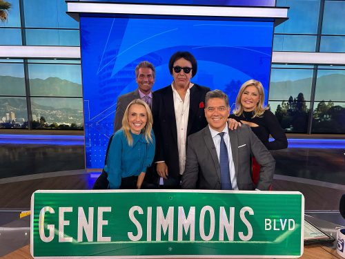 Gene Simmons with the Gene Simmons BLVD Sign