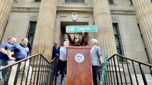 Gene Simmons, KISS bassist, holds a street signing donning the name "Gene Simmons Boulevard with North Tonwanda Mayor Austin Tyler (left) and Falls Mayor Robert Restaino (right). A portion of Main Street between Pine and Cedar avenues was also temporarily renamed to recognize Simmons' business partnership with with brothers John and Paul Janik, third generation soda producers, along with their business partner and longtime friend Chris Haick.