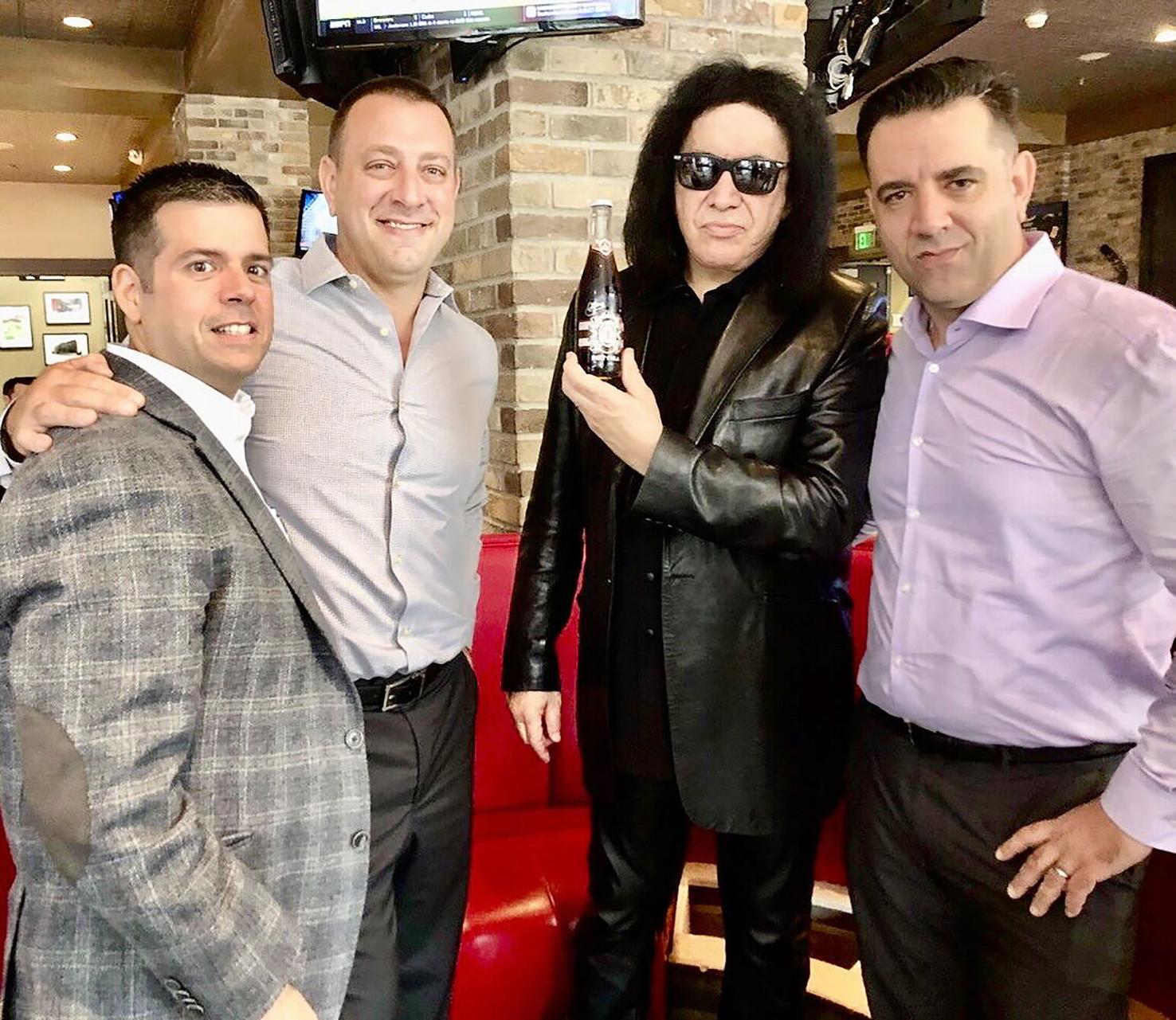 Chris Haick, left, John Janik, Gene Simmons and Paul Janik formed a partnership in 2017 to create MoneyBag Soda.